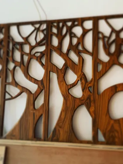 A duplicate of the CNC-cut tree mural, highlighting the intricate detail of the branches.