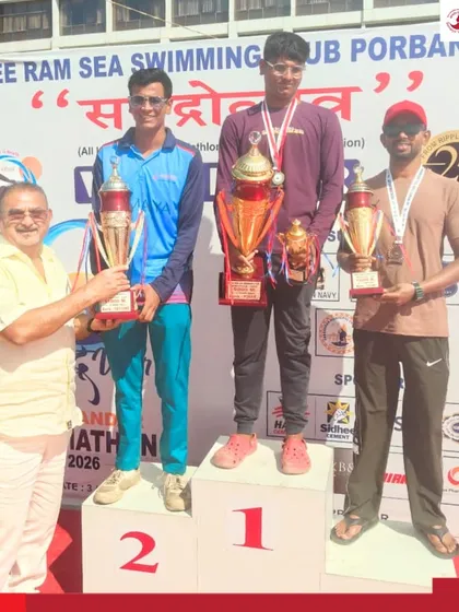 Varad Ghanshyam Kuvar stands on the podium after securing second place in a challenging 15 km swimming event organized by Shree Ram Sea Swimming Club.