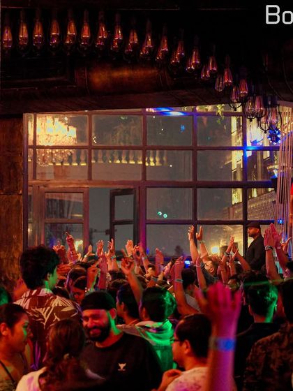 The unique, elegant interior of Bombay Adda filled with an energetic crowd. I adapt my set to match the vibe of each venue.