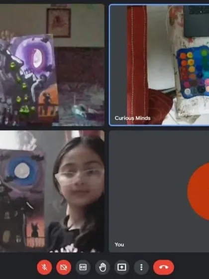 Our online Halloween-themed workshop was a spooky success! These students are showing off their haunted house paintings.