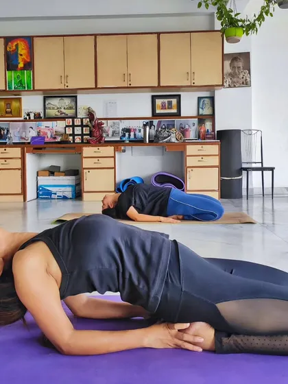Students in Supta Virasana (Reclining Hero Pose) during a session. My classes incorporate restorative poses to release tension and improve flexibility in a supportive environment.