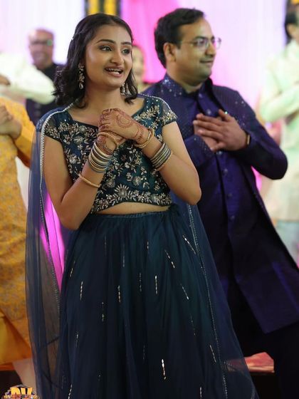 A candid shot of the client dancing and enjoying the event in her rented outfit.