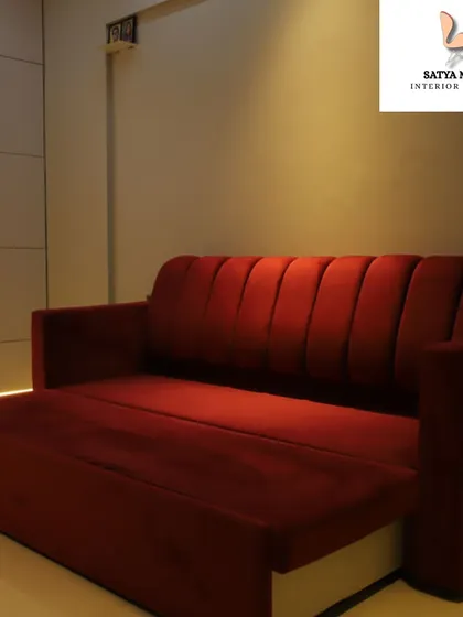 A functional and stylish red sofa bed, perfect for a guest room or a multi-purpose space, offering both seating and sleeping options.