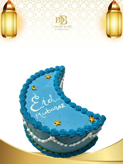 A crescent moon shaped cake for Eid Mubarak. This beautiful blue cake is decorated with golden stars and elegant piping, making it a perfect sweet treat for your Eid festivities.