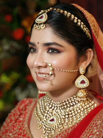 This portrait captures the bride's bright and happy expression. The makeup is designed to last through all the emotions of the day while keeping her looking fresh and radiant.
