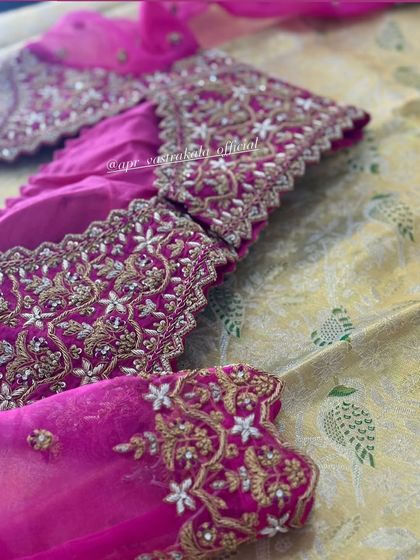 Another detail shot of the pink floral embroidery.