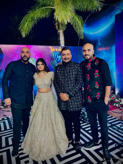 Posing with the happy couple and my Kudos DJ partner in India. The jungle-themed party was next-level vibes.