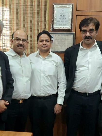 Enjoying a sweet treat with colleagues after an Eid invitation. These gestures of goodwill strengthen our bonds within the legal community.