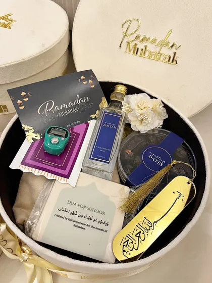 A look inside my premium Ramadan velvet hamper. It's filled with essentials like Zamzam water, premium dates, a Tasbeeh counter, and a Dua card for Suhoor.