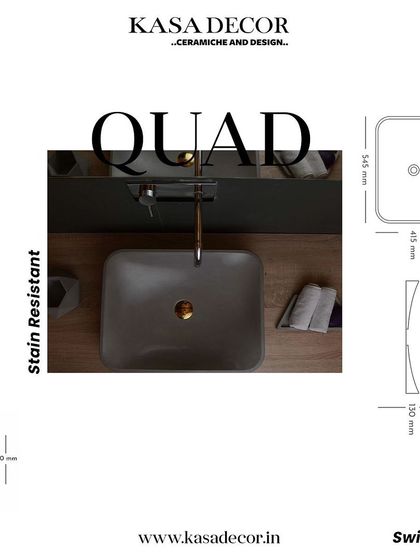 The 'Quad' concrete basin, featuring a rectangular shape with soft, curved interiors. This stain-resistant basin combines geometric form with functional elegance.