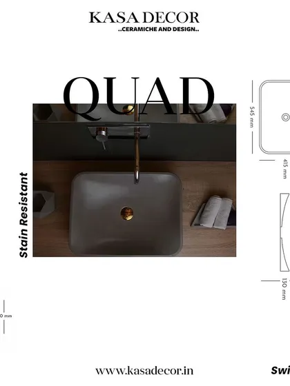 The 'Quad' concrete basin, featuring a rectangular shape with soft, curved interiors. This stain-resistant basin combines geometric form with functional elegance.