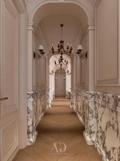 This corridor embraces classical principles with its arched ceilings and marble-clad half-walls. The design creates a formal yet flowing transition between spaces, using traditional materials like wood and marble to establish a sense of enduring quality.