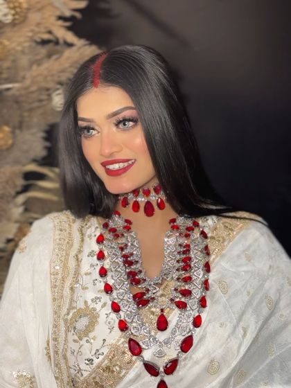 The full look, complete with the white saree and ruby jewellery. It's all about capturing the complete vibe of the original.