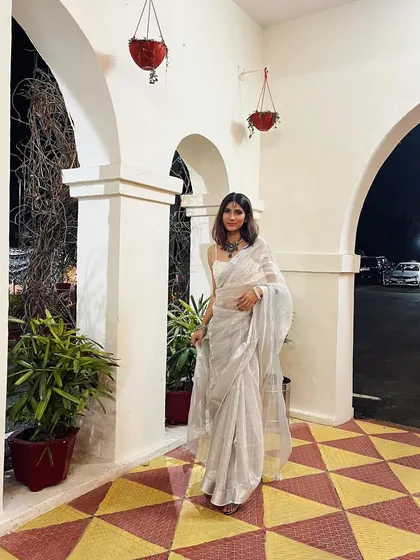 Kicking off a roundup of my favorite sari looks. This elegant white and silver sari is perfect for an evening event, paired with a statement necklace.