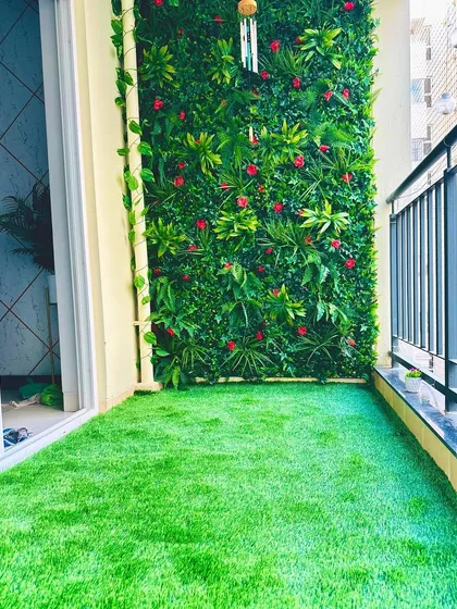 A complete balcony makeover in a Bangalore apartment. We installed our soft, durable turf on the floor and created a custom vertical garden wall with pops of red, turning a standard balcony into a private, vibrant oasis.