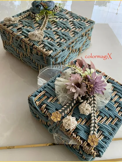 Two of our elegant blue and gold woven jute hampers, showcasing their consistent quality and beautiful design. Perfect for coordinated gifting.