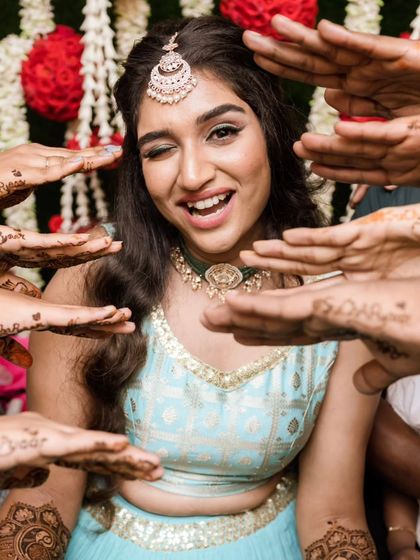 A cheeky wink for the camera. This close-up shows the clean winged eyeliner and the overall fresh, glowing makeup look.