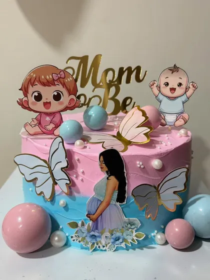 A one-kg Chocolate Ganache baby shower cake. The pink and blue theme is perfect for a gender-neutral celebration for the "Mom to Be.".