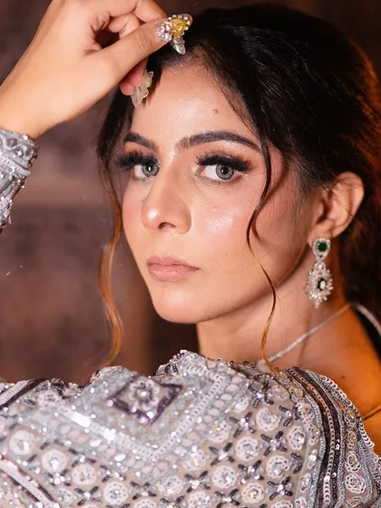 A complete look at my silver-grey geometric lehenga from a professional shoot. You can see the intricate details, the stylish back, and how it moves. It's a true work of art.