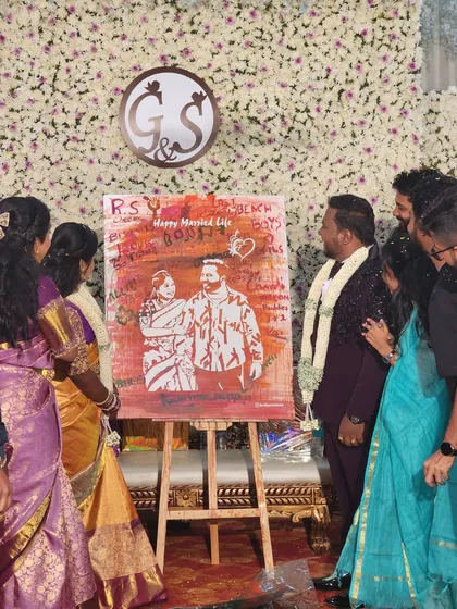 A live painting always becomes a point of interest for guests. I love it when family and friends gather around to watch the art unfold and see the final reveal with the couple.