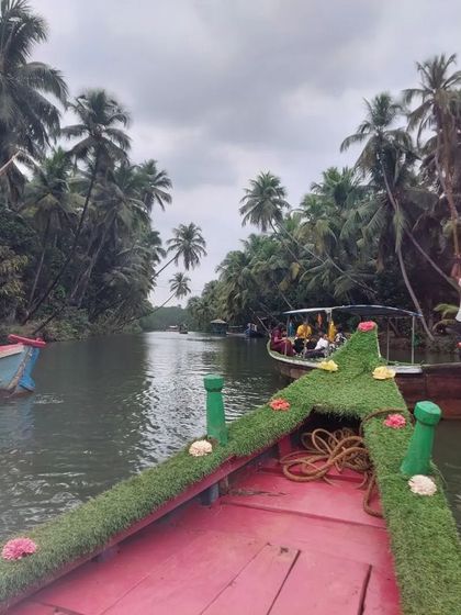Enjoying a peaceful boat ride in the backwaters of Honnavara, a relaxing part of our coastal trip.