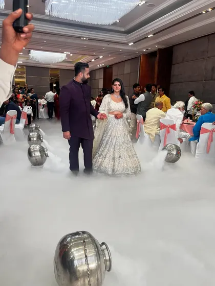 Capturing the grand entrance from another perspective. I coordinate with photographers and videographers to ensure these key moments are captured perfectly.