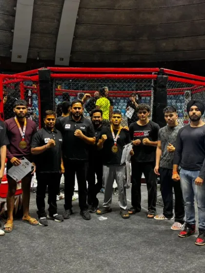 The MMA FitZone team standing proud in front of the octagon, showcasing the depth of our competitive roster.