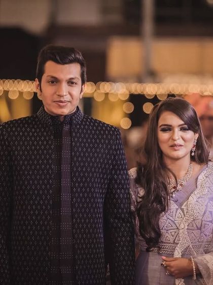 A classic black open Indo-Western jacket, elevated with subtle moti and katdana work. This outfit is designed for formal evening events where elegance is key.