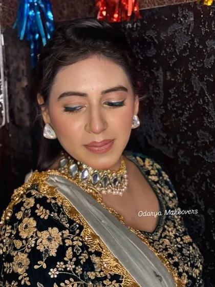 A close-up of the eye makeup. A touch of silver liner on the inner corner makes the eyes pop.