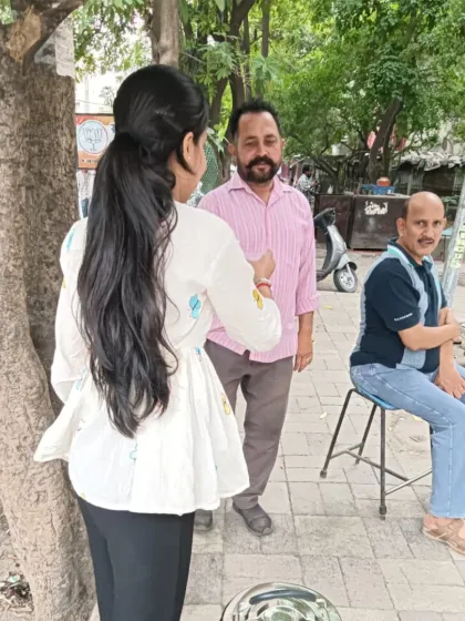 A volunteer engages with community members while serving Chabeel. These moments of connection are just as important as the service itself.