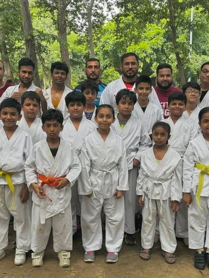 Our team after a successful outdoor belt test. Training and testing together in the park builds a unique sense of camaraderie and shared accomplishment.