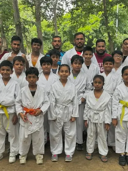 Our team after a successful outdoor belt test. Training and testing together in the park builds a unique sense of camaraderie and shared accomplishment.