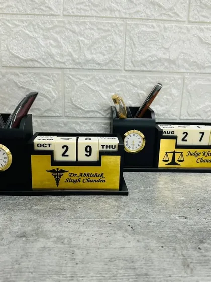 These lifetime desk calendars are both practical and personal. They include a pen stand, a small clock, and a customizable plate where I can add a name, designation, or company logo, making them ideal for corporate gifting.