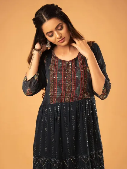A graceful pose that shows the flow of the tiered dress.