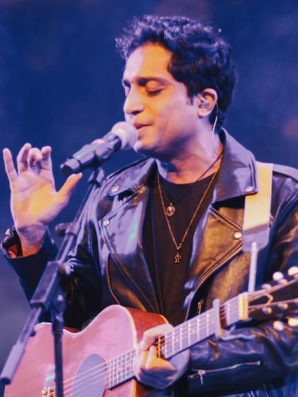 A profile shot of Nikhil D'Souza, capturing the emotion he pours into his music.
