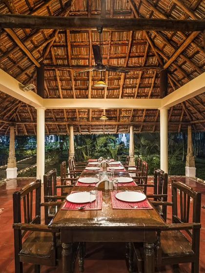The dining hall set for dinner. The long communal table encourages connection and friendship among our guests from all over the world, making mealtime a special part of the day.