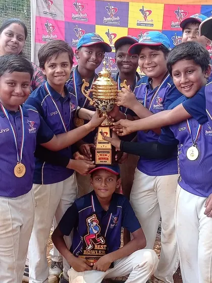 The U-12 PTPL 2024 champions, Team Purple, huddle together to celebrate their victory. The energy and camaraderie are what make our academy a family.