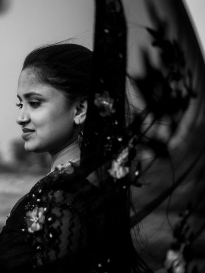 An artistic black and white portrait of the bride-to-be, using her dupatta to create a sense of movement and elegance. This highlights my focus on creating beautiful, individual shots within a couple's session.