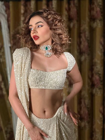 A candid moment. Even when she's not looking at the camera, she is a vision.