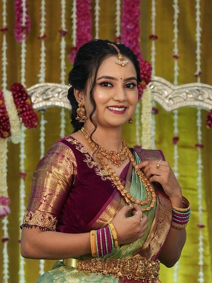 Another beautiful portrait of Harshitha, showing her complete look for the special day.
