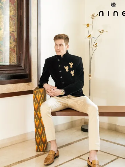 The Angrakha bandhgala styled for a formal event. The clean lines and unique embroidery make it a sophisticated choice that stands out from the crowd.