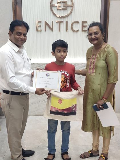 The smile says it all. We love seeing the pride our students feel when they complete their artwork. It's a joy to celebrate their creativity with them.