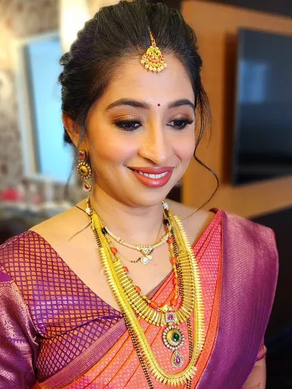 Subtle, smouldering eyes and a flawless base for a beautiful bride from the Hegde community, showcasing a classic and elegant style.