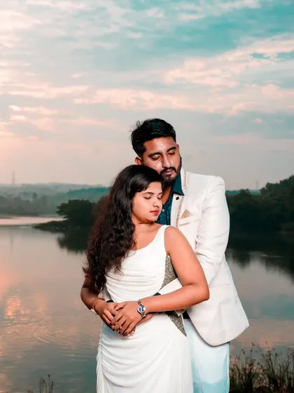 A romantic embrace by the lake at sunset. The beautiful natural light and serene setting make this a perfect photo for a "Save the Date."