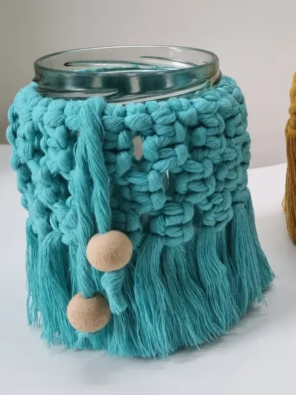 A close-up of the teal jar cover, a perfect accessory to upcycle any glass jar.