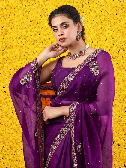 A close-up of the embroidered pallu, showcasing the fine attention to detail.