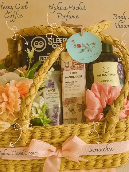 A perfect Rakhi gift for your sister, this beautiful woven basket is filled with her favorites like Sleepy Owl coffee, a Body Shop shower gel, Nykaa hand cream and perfume, and a cute scrunchie.