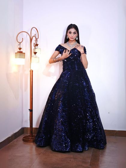 This shot highlights the sparkling texture of the gown and the beautiful diamond necklace.