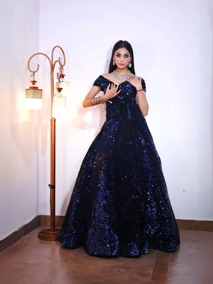 This shot highlights the sparkling texture of the gown and the beautiful diamond necklace.