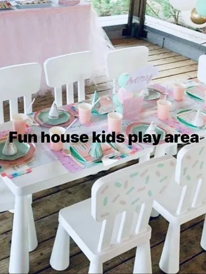 A charming and intimate setup of our white table and chairs on a wooden deck, decorated for a small birthday gathering. This is ideal for playdates or smaller parties.
